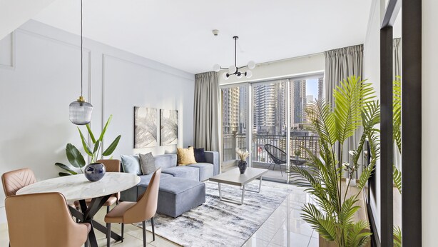 A modern living room with a dining area, large windows, and a view of the cityscape. - Silkhaus Standpoint, Downtown Dubai (Dubai)
