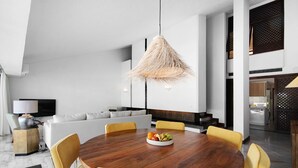 A modern dining area with a wooden table, yellow chairs, and a woven pendant light. - Vacation Home "Vilamoura Com Piscina E Wifi" with Private Pool, Terraces & Wi-Fi (Vilamoura)