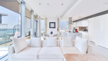 Grand Apartment, 2 Bedrooms, Sea View, Beachfront | Living area | 75-inch LED TV with satellite channels, TV, Netflix