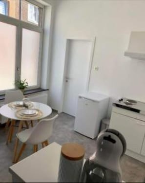 Fridge, coffee/tea maker, cookware/dishes/utensils, dining tables