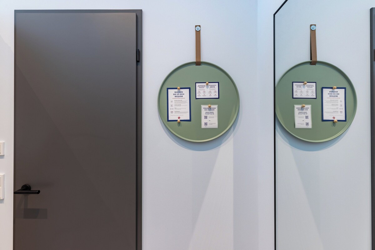 Two doors with circular signs, one door is closed, and the other is open.