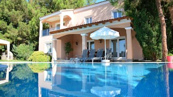 Indoor pool, seasonal outdoor pool, pool umbrellas, pool loungers