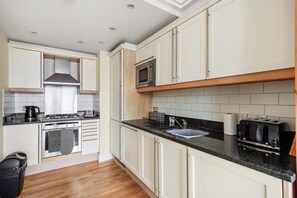 Apartment | Private kitchen | Fridge, microwave, oven, stovetop