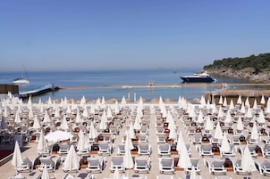 Private beach, free beach shuttle, beach bar