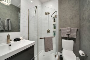 A modern bathroom with a glass-enclosed shower, a white sink, and a toilet. - 3 Bd, 3 Ba Mountain Village, Telluride Condo, Ski in ski out on Sunset Plaza (Telluride)