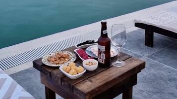 Outdoor pool, sun loungers, lifeguards on site