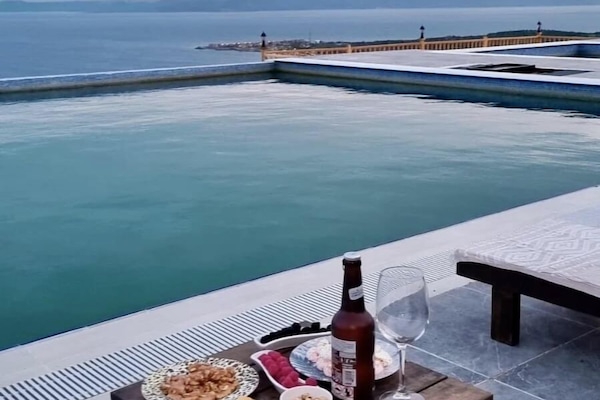 Outdoor pool, sun loungers, lifeguards on site