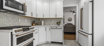 Updated home with canal & hot tub in backyard. Close to everything!