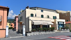 A two-story building with a cafe named "Antichità" on the ground floor.