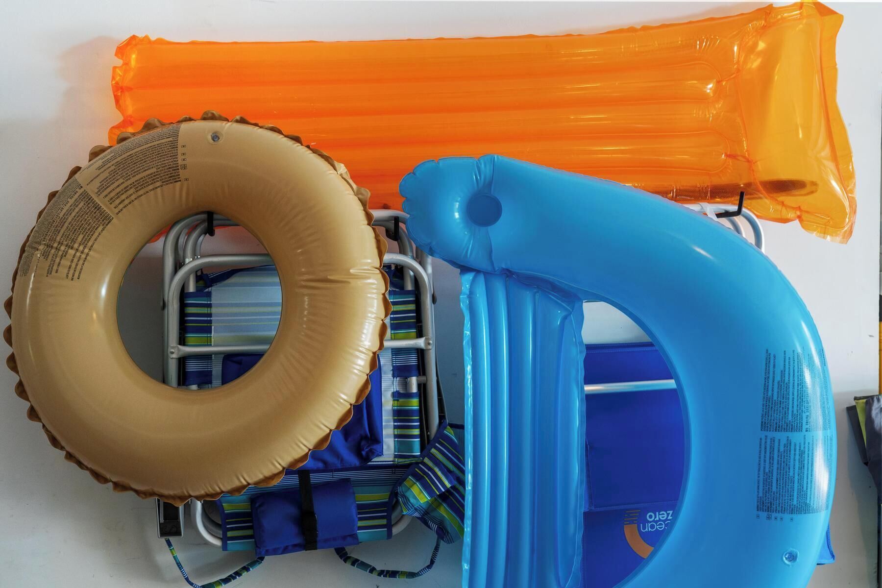 A pool float set up with a ring float and a long tube float.
