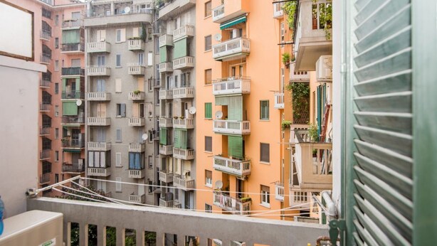 A multi-story residential building with balconies, some with plants. - The Best Rent - Two-bedroom apatment in Milan (Milano)