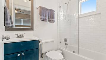 Bathtub, hair dryer, towels