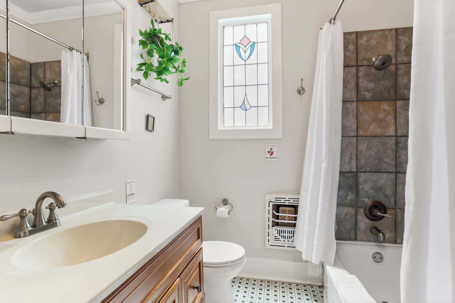 Bathtub, hair dryer, towels, shampoo