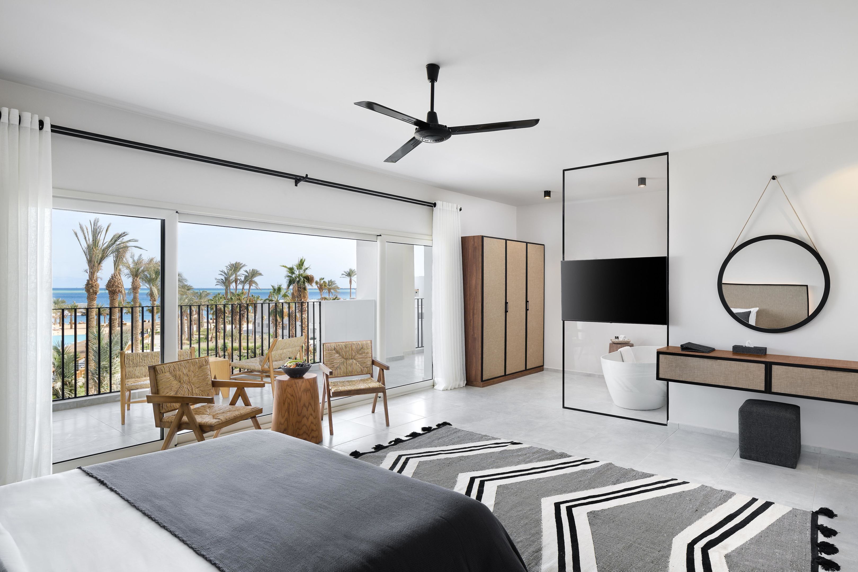 Suite, 2 Bedrooms, Sea View | Minibar, in-room safe, blackout curtains, iron/ironing board