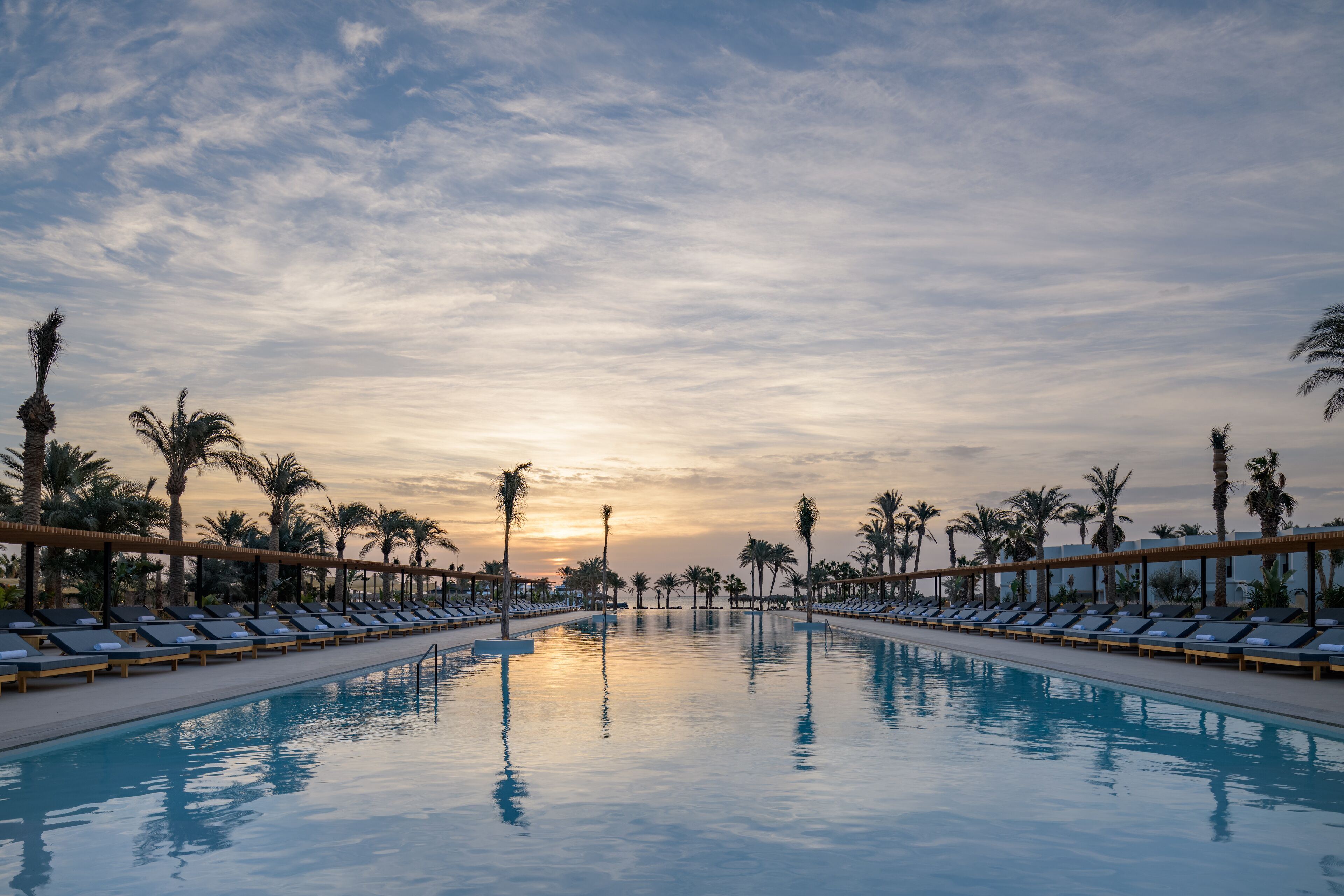 2 outdoor pools, pool umbrellas, pool loungers