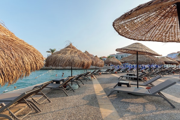 Private beach nearby, white sand, sun loungers, beach umbrellas