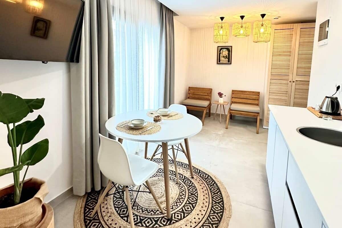 Junior Suite, 1 King Bed | Living area | 43-inch LED TV with satellite channels, TV