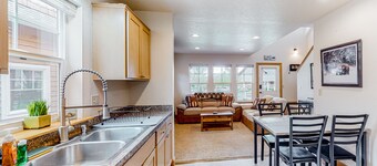 Adorable, two-story home with a furnished front porch, fireplace, & washer/dryer