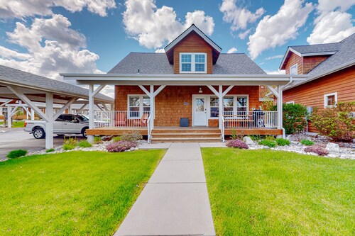 Adorable, two-story home with a furnished front porch, fireplace, & washer/dryer