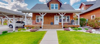 Adorable, two-story home with a furnished front porch, fireplace, & washer/dryer