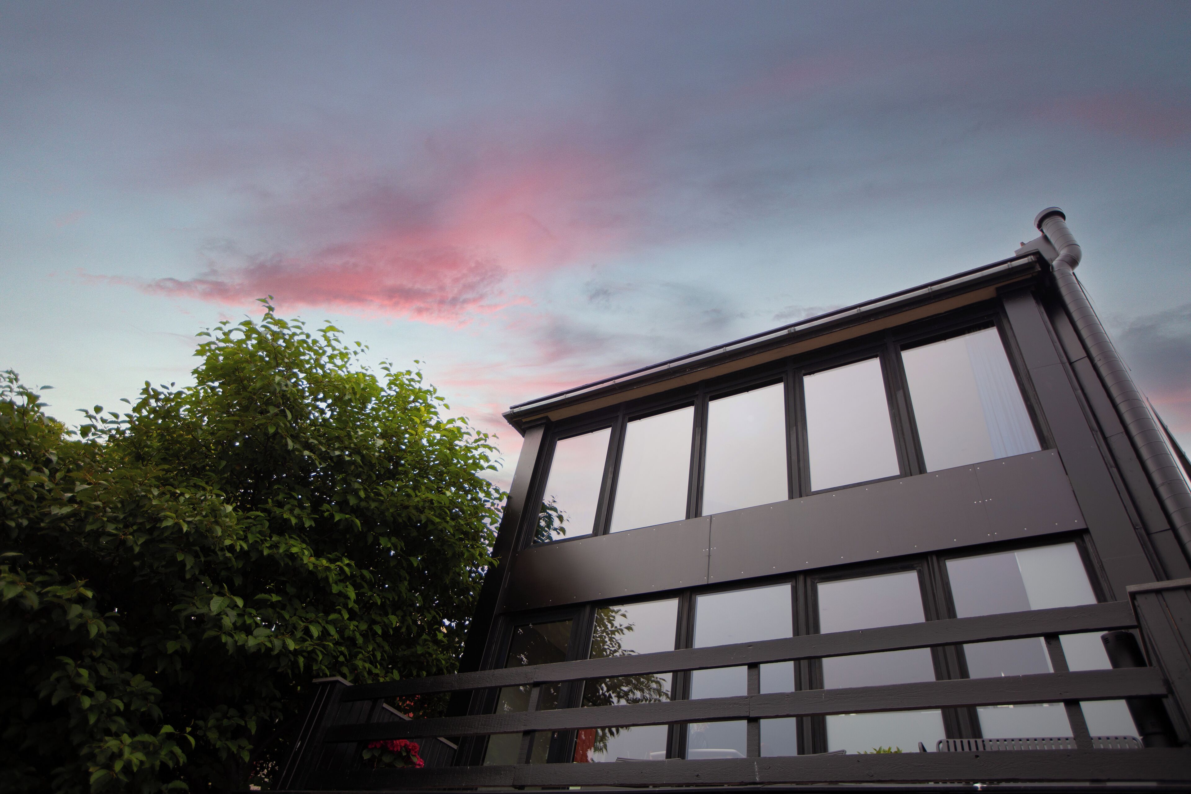 A modern building with large windows and a flat roof.