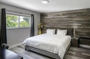 1 bedroom, desk, iron/ironing board, travel crib