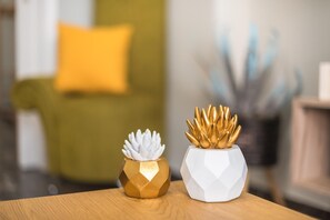 Two hexagonal planters with succulent plants on a wooden table. - Stylish Suite by Cloudkeys (Zografos)