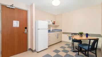 Economy Room | Private kitchen | Full-size fridge, microwave, dining tables