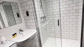 Hair dryer, towels, soap, shampoo