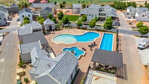 A residential area with a swimming pool, houses, and a road. - The Sandlot - Sand Hollow & Zion - Entire Home with Private Pool (Hurricane)
