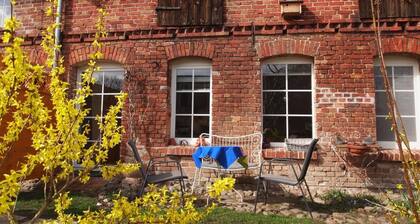 Apartment in a farmhouse with idyllic courtyard and natural garden