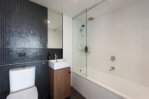 Bathtub, hair dryer, shampoo