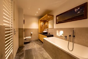 Bathtub, hair dryer, towels