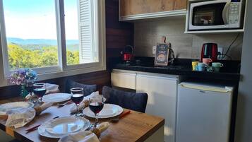 Basic Chalet | Private kitchen | Cookware/dishes/utensils, dining tables