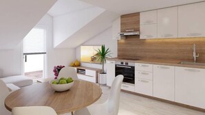 Une cuisine moderne avec des armoires blanches, un plan de travail en bois et un four encastré.
