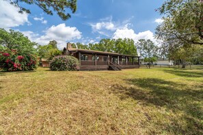 Surrounded by lush gardens, this cabin-style building offers a serene atmosphere.
