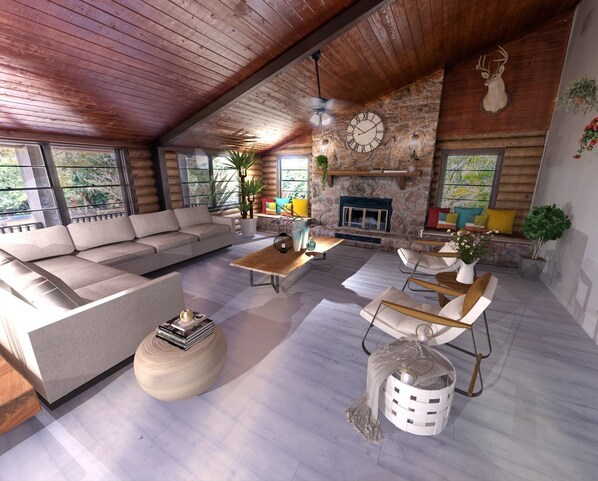 Cozy living space with a large stone fireplace, comfortable sofa, and dining area.