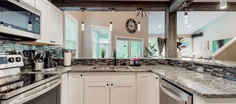 Inviting riverfront home with hot tub, firepit, W/D, & dog-friendly