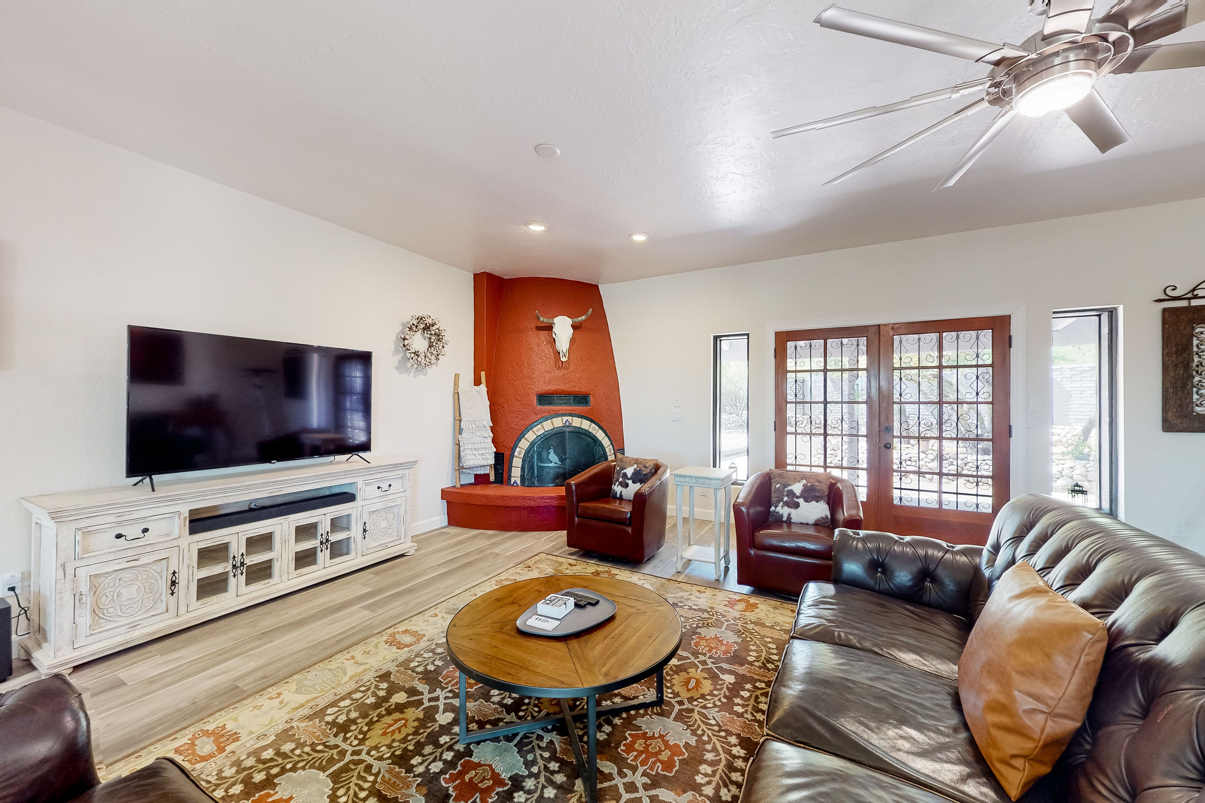 Dog-friendly home with lovely desert views, fenced yard, patio & fireplace