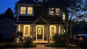 A two-story house with a gabled roof and a front porch. - Walk or bike to everything Lewes has to offer! (Lewes)