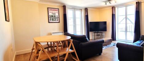 Classic Apartment, 2 Bedrooms | Living area | Flat-screen TV