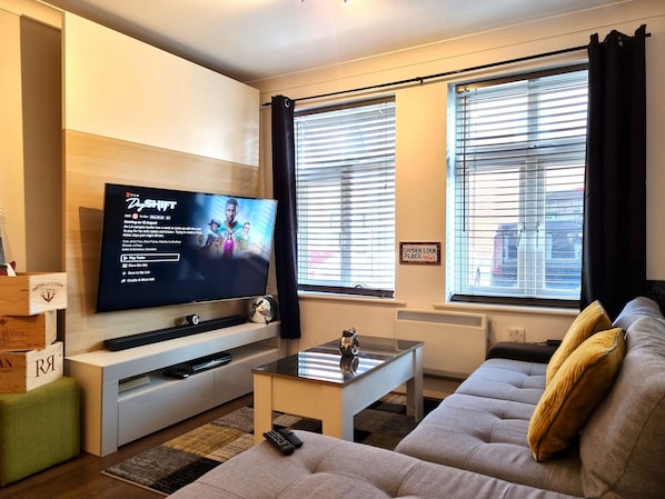 Classic Apartment, 1 Bedroom | Living room | Flat-screen TV