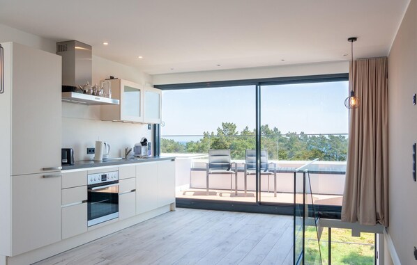 Fridge, stovetop, dishwasher, coffee/tea maker