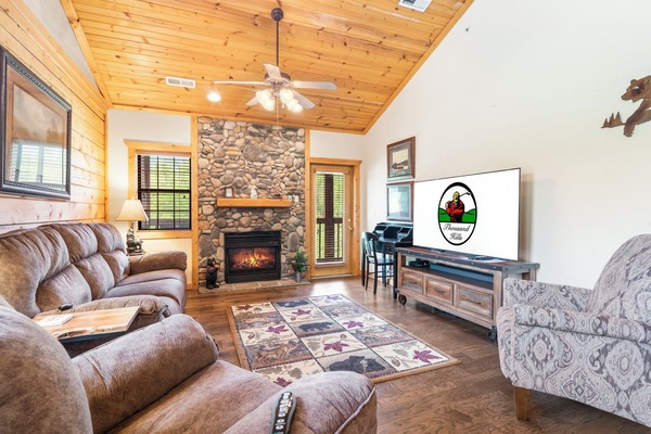 Living Room with Deck Access, Work Station Desk, Cable TV, and Seasonal Gas Fireplace