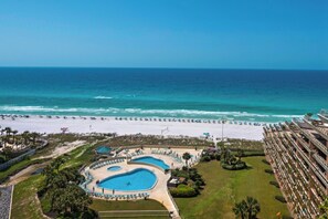 A resort with a large pool area, a beach, and a view of the ocean. - Edgewater Beach Condo 1503 (Destin)