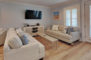 House, Multiple Beds, Balcony, Pool View (#E) | Living area | TV - Sandpiper Cottages #E by Southern Vacation Rentals (Gulf Shores)