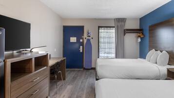 Desk, laptop workspace, bed sheets