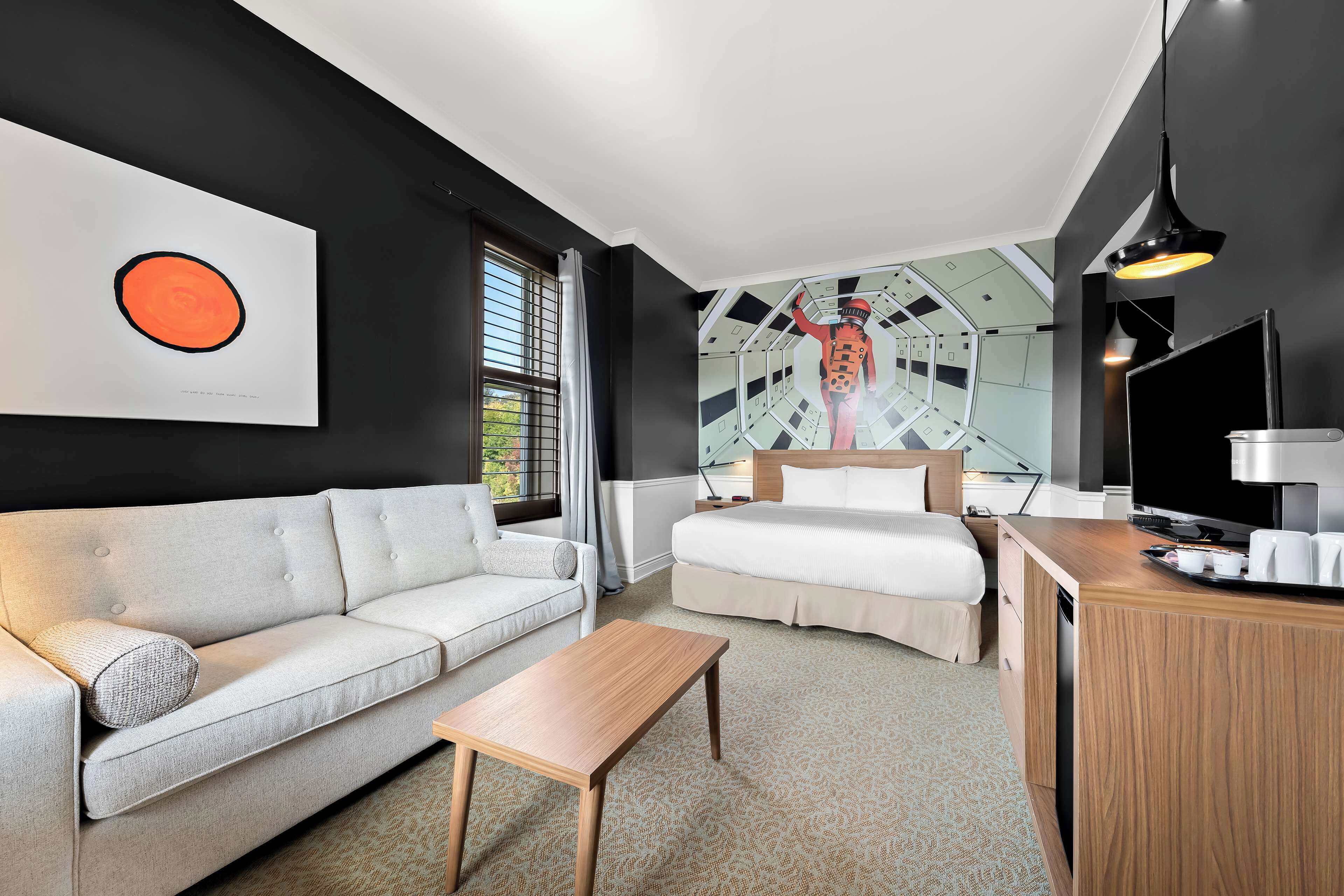 Suite, 1 King Bed, Non Smoking | Desk, blackout drapes, iron/ironing board, bed sheets