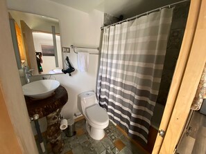 Classic Quadruple Room | Bathroom | Hair dryer, towels, soap, shampoo