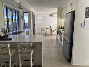 Private kitchen - Beachy family home with just a walk to the beach or a 5 minute drive into Noosa. (Sunrise Beach)